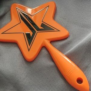 Orange Jeffree Star hand mirror